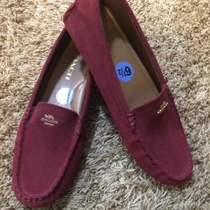 Red suede Coach brand loafers